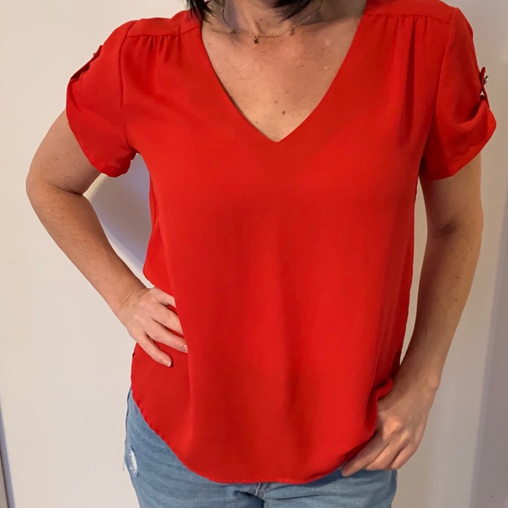 Red flowy style shirt